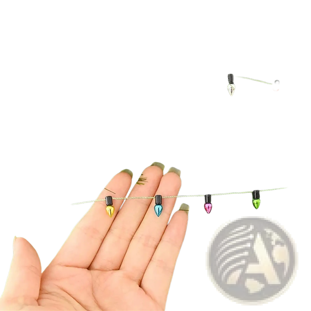 Colorful christmas garland string lights featuring miniature bulbs in pink blue yellow green white and orange with black bases