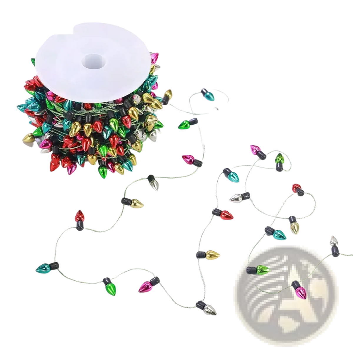 A spool of colorful christmas garland string lights with shiny metallic bulbs in red green gold and pink