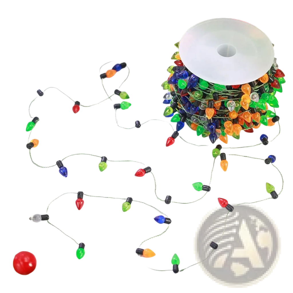 A spool of colorful christmas garland string lights with red green blue orange and clear led bulbs on a thin wire