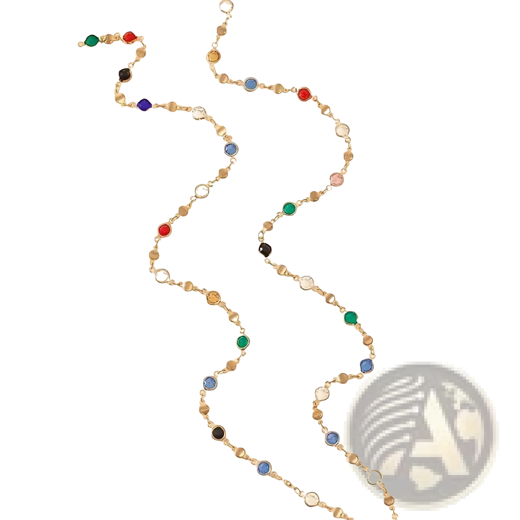 A delicate gold-toned chain necklace with colorful red, blue, green, black, and clear crystal gemstones