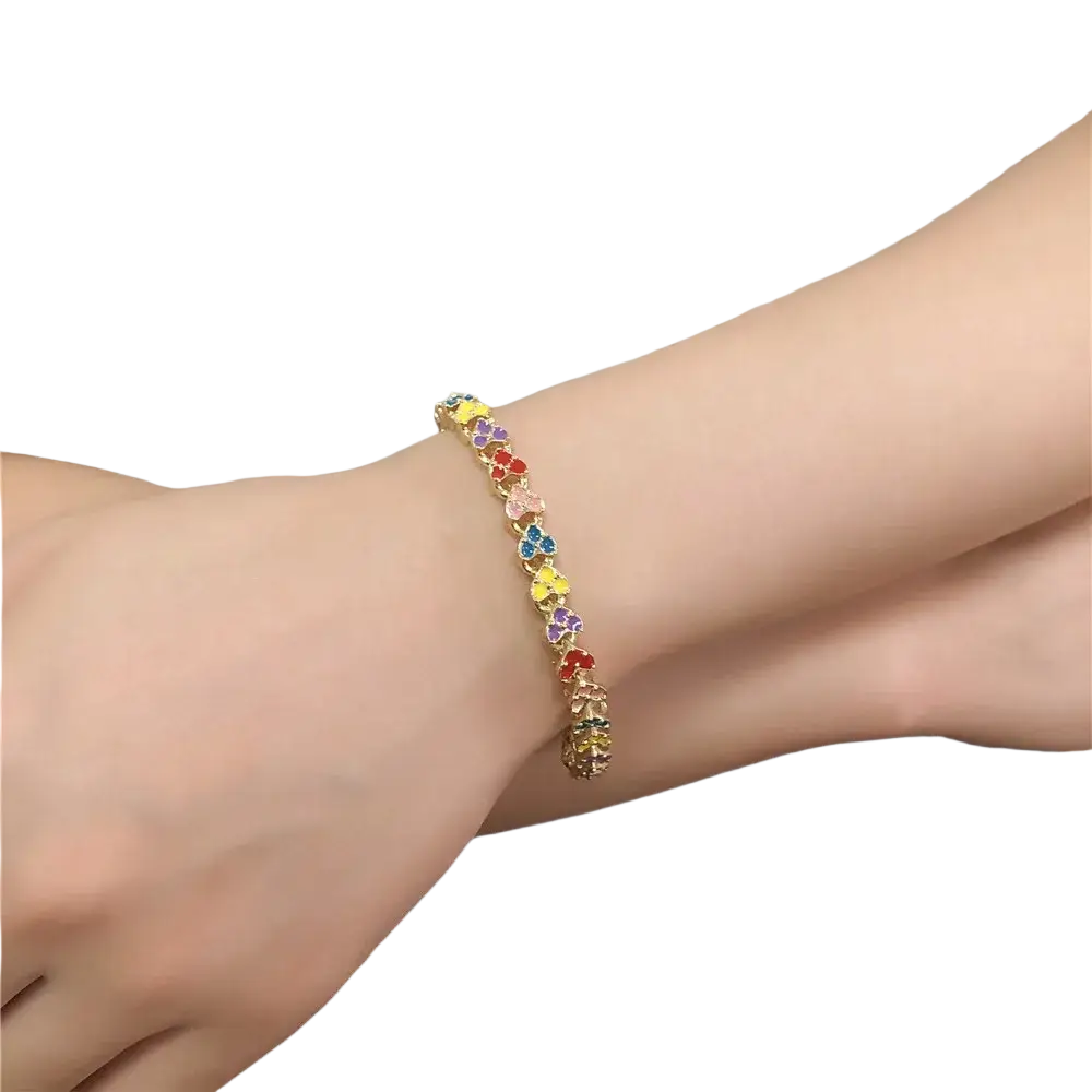 A delicate gold chain bracelet featuring colorful enamel clover charms in a vibrant rainbow pattern
