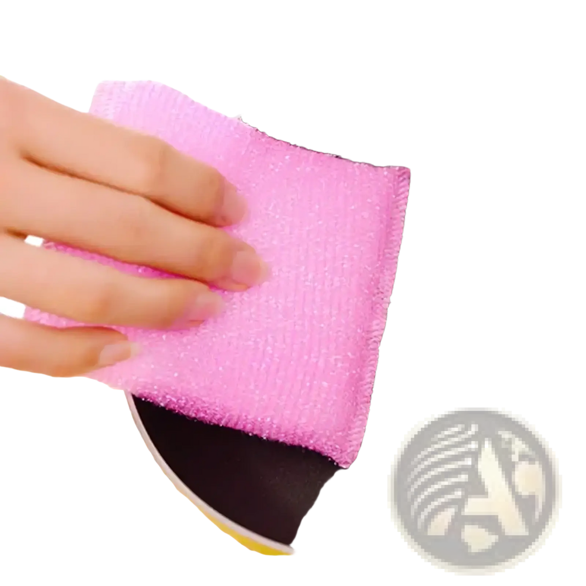 Pink abrasive kitchen sponge scrubber cleaning a black non-stick frying pan from colorful kitchen sponge 4 pack