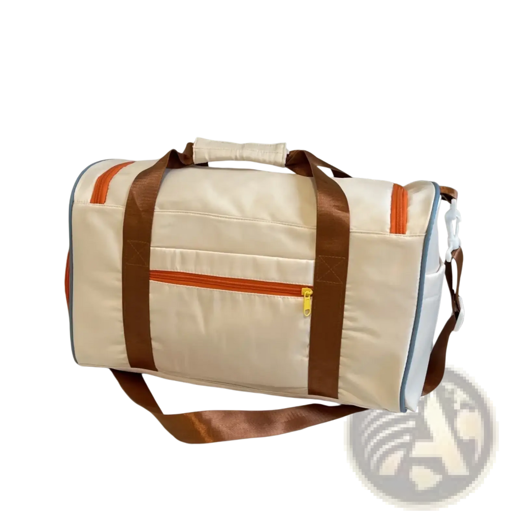 Cream-colored multi pocket travel duffel bag with brown straps and orange zipper accents for organized travel