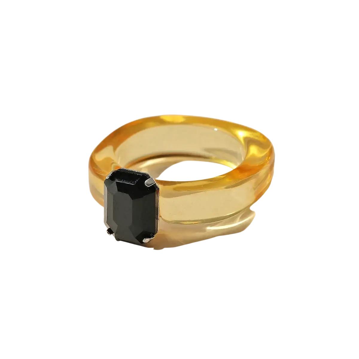 A colorful resin crystal geometric ring for women featuring a sleek translucent amber band with a bold black emerald stone
