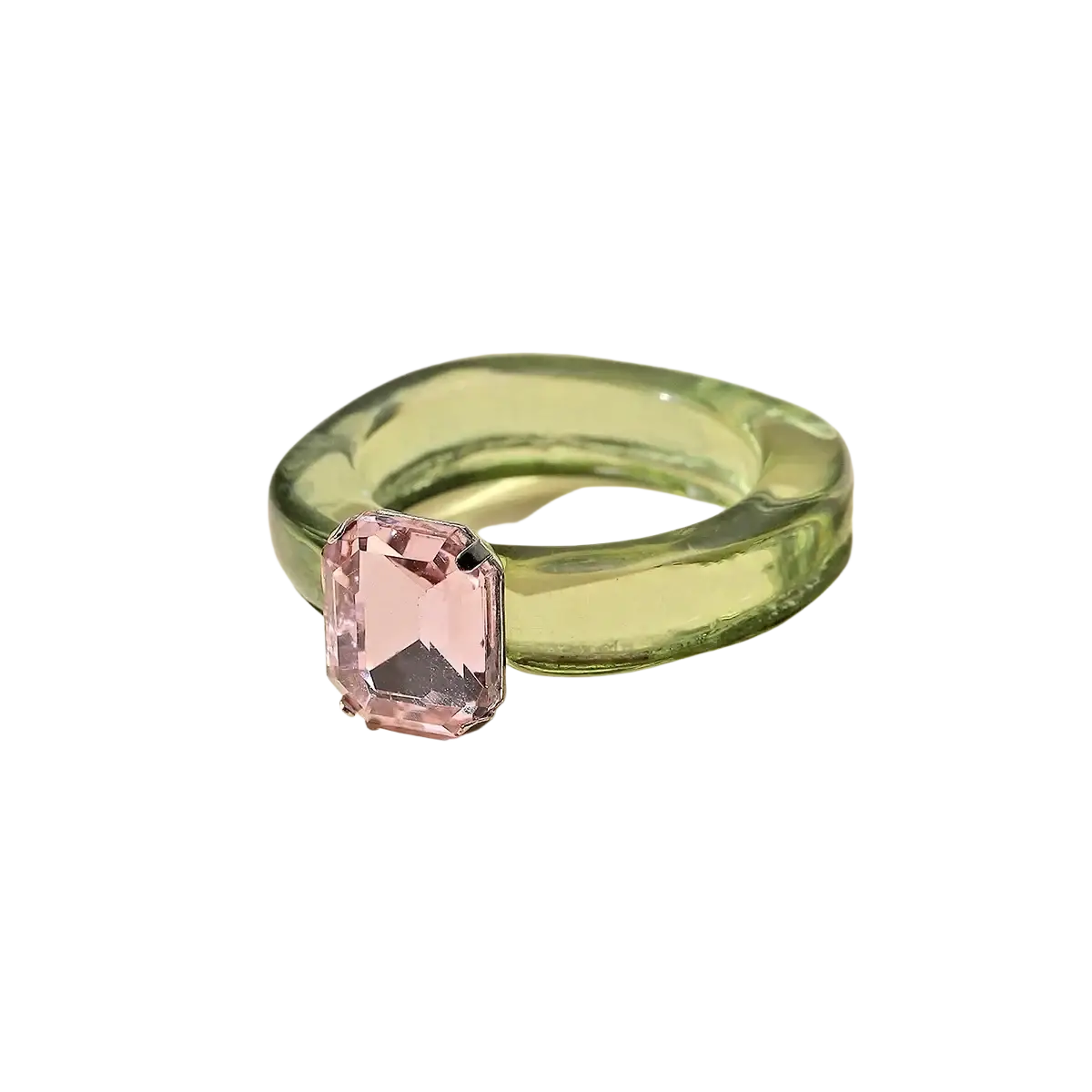 A colorful resin crystal geometric ring for women with a translucent green glass band and a pink emerald-cut gemstone