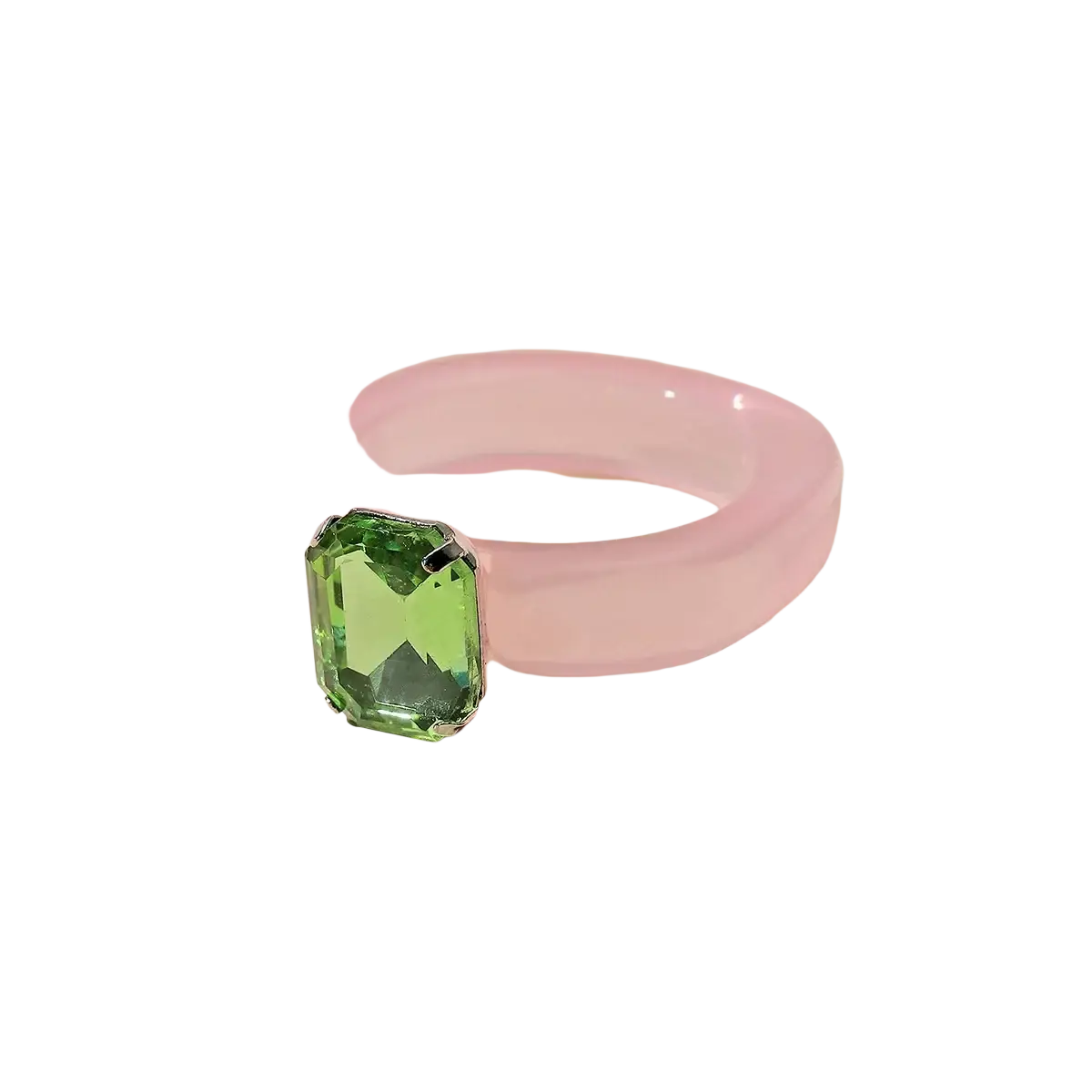 Colorful resin crystal geometric ring for women with a translucent pink band and emerald-cut green gemstone set in silver metal