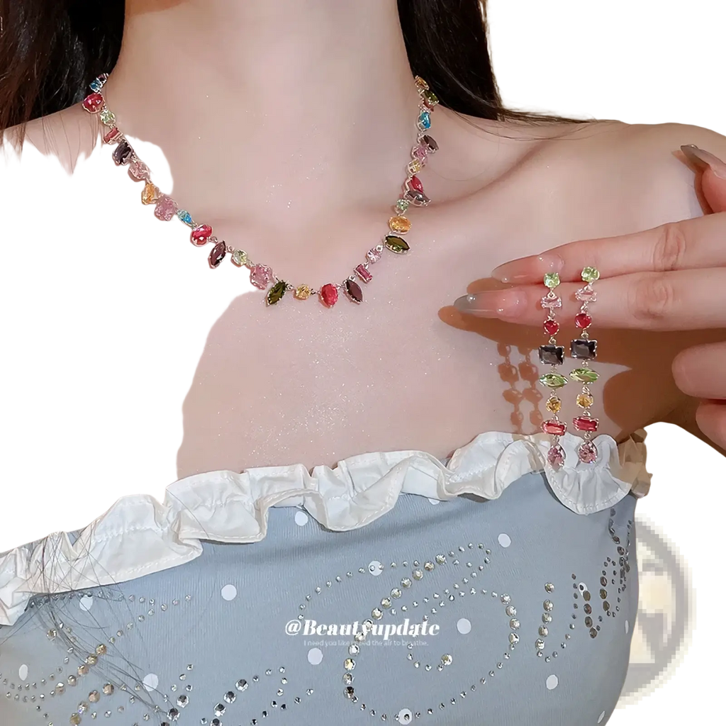 A colorful zircon crystal gold plated necklace with vibrant multicolored faceted gemstones on a slender chain