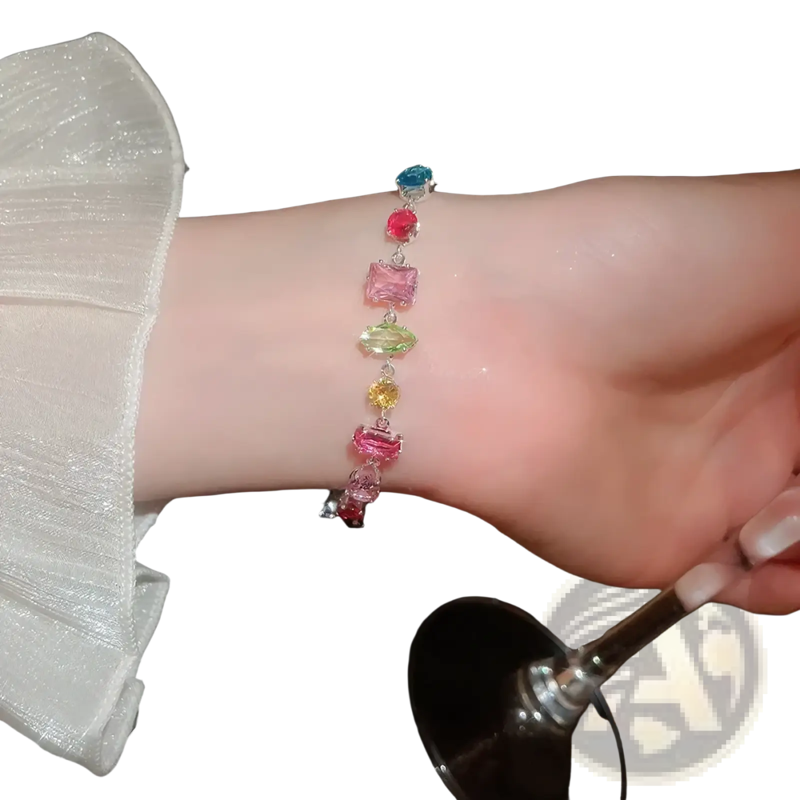 A delicate silver bracelet adorned with colorful faceted gemstones complements the colorful zircon crystal gold plated necklace