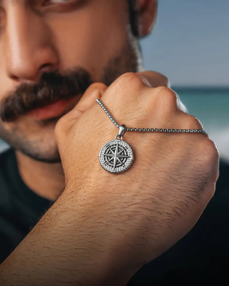 Silver compass locket necklace in stainless steel featuring a silver compass pendant on a fine chain