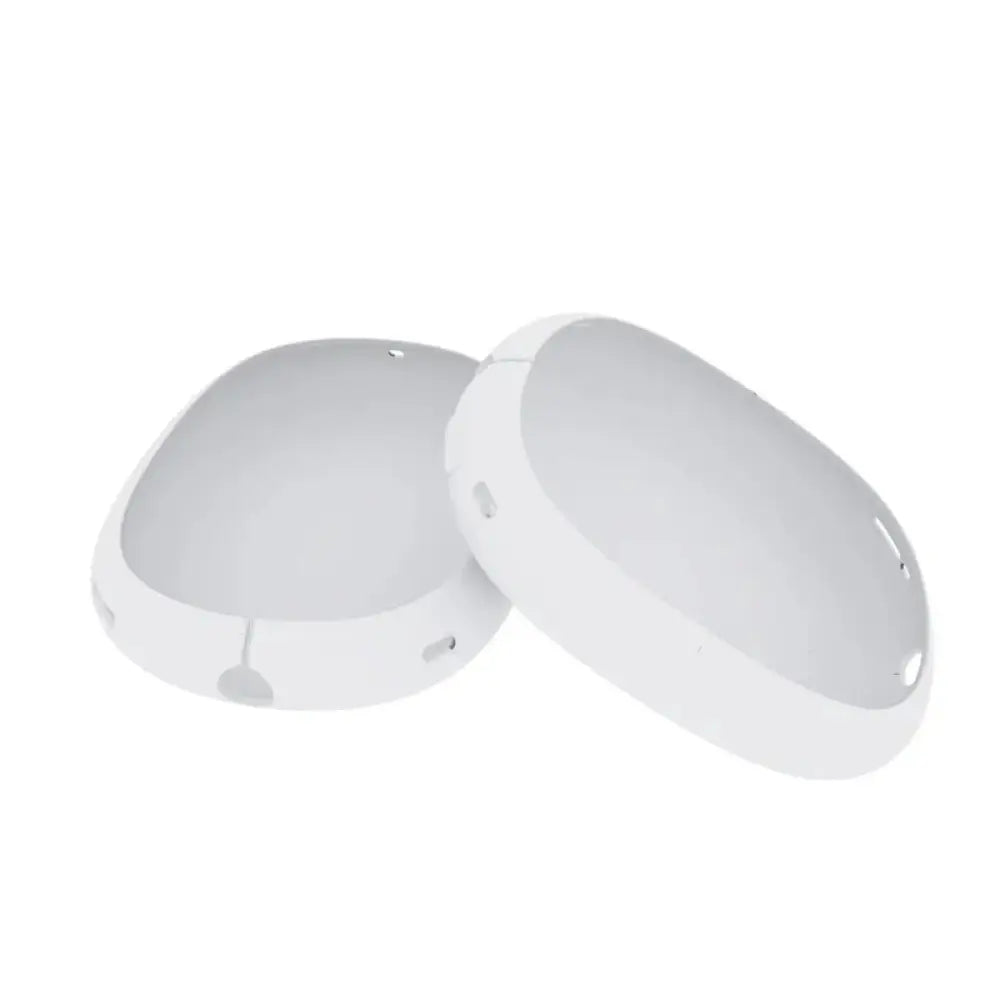 White oval-shaped silicone earcup covers for airpods max with smooth plastic surface and circular cutouts along edges
