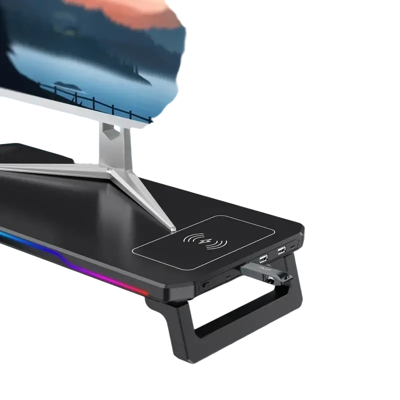 Black plastic computer monitor riser with rgb lighting and wireless charging pad supporting input port voltage