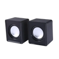 Black cube-shaped USB mini computer speakers with white circular drivers for stereo desktop sound system use