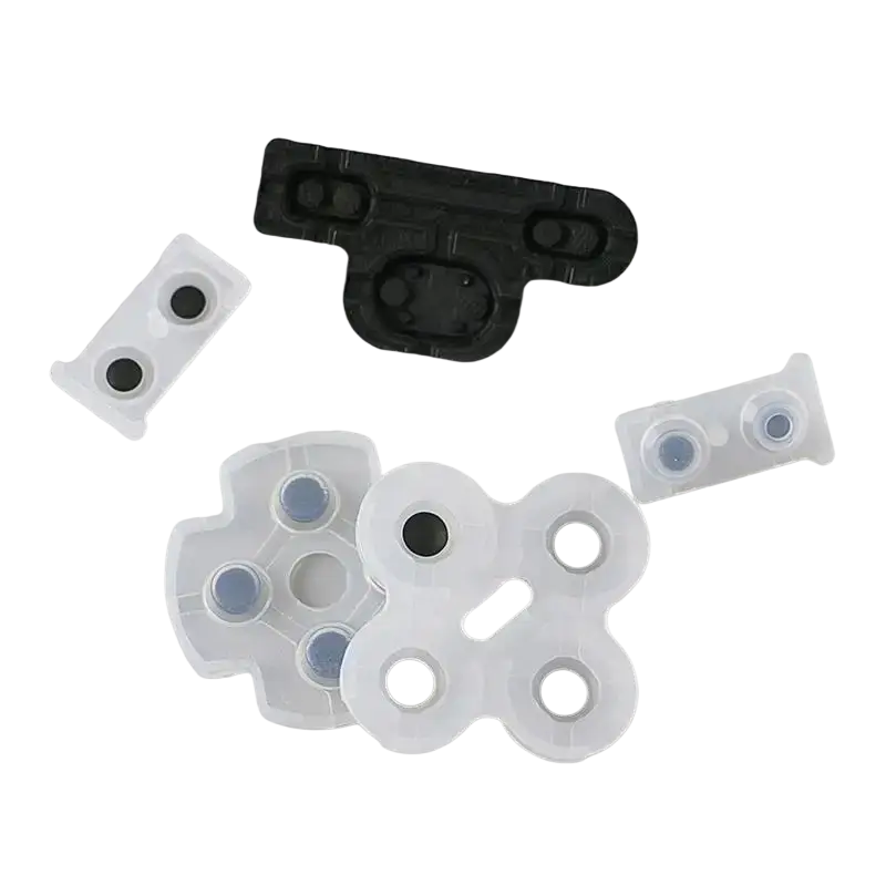 White plastic game controller button caps with black and blue circular inserts for conductive rubber pad set