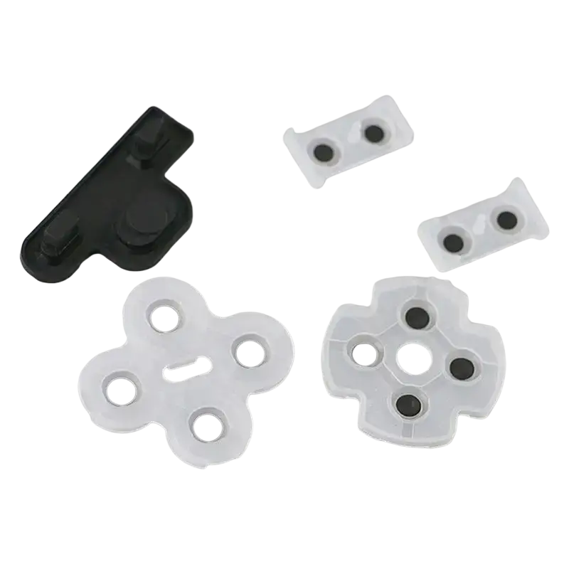 Conductive rubber pad set showing white translucent plastic directional pad inserts with black circular buttons for playstation 3 controller