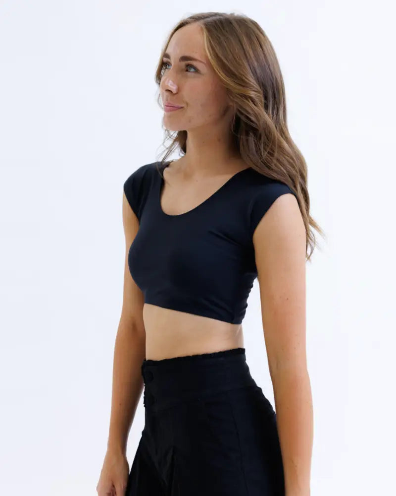 Black short-sleeved crop top with rounded neckline fitted silhouette contour demi cropped shaping tee with moisture wicking fabric