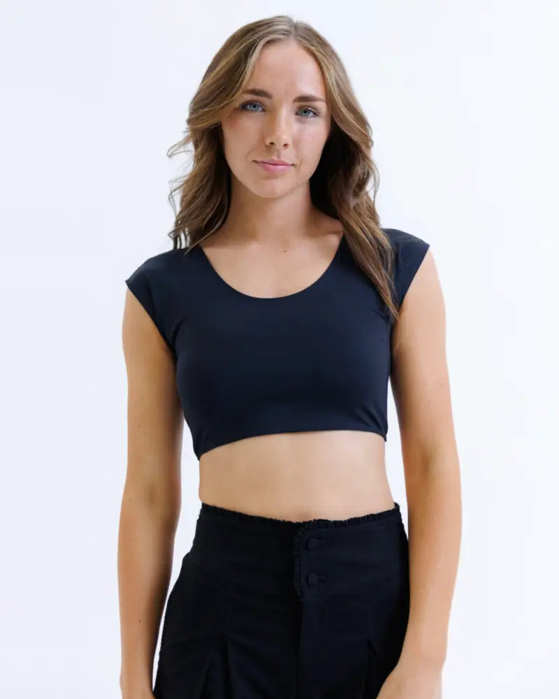 Black sleeveless contour demi cropped shaping tee with rounded neckline and moisture wicking soft stretchy fabric