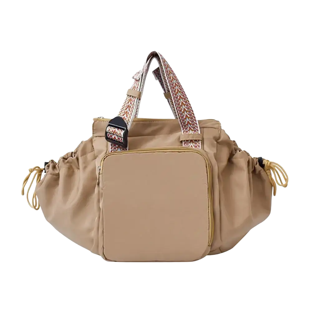 Beige nylon convertible tote backpack with large capacity, patterned woven straps, and front zippered compartment