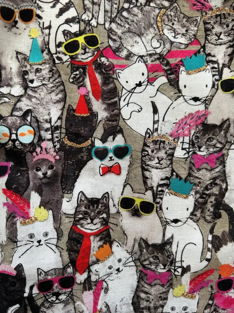 Cool cats retro shorter length fit and flare dress with light beige fabric featuring cartoon cats wearing sunglasses hats and bow ties