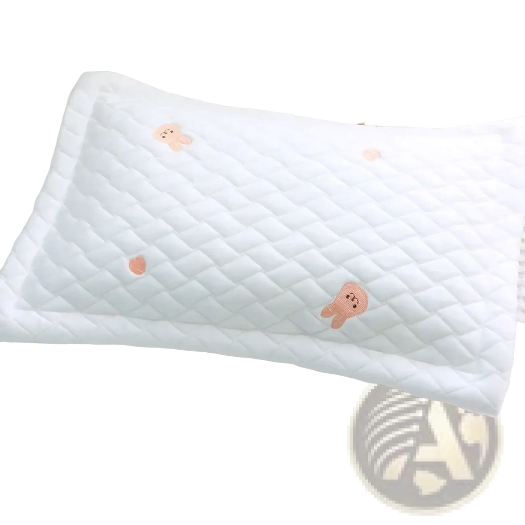 White quilted cool ice silk baby pillow with soft pink embroidered bear faces for infant comfort and support