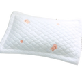White quilted cool ice silk baby pillow with soft pink embroidered bear faces for infant comfort and support