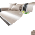 Beige cooling rattan sofa cushion with woven fabric cover, subtle grid pattern, nonslip black trim protector