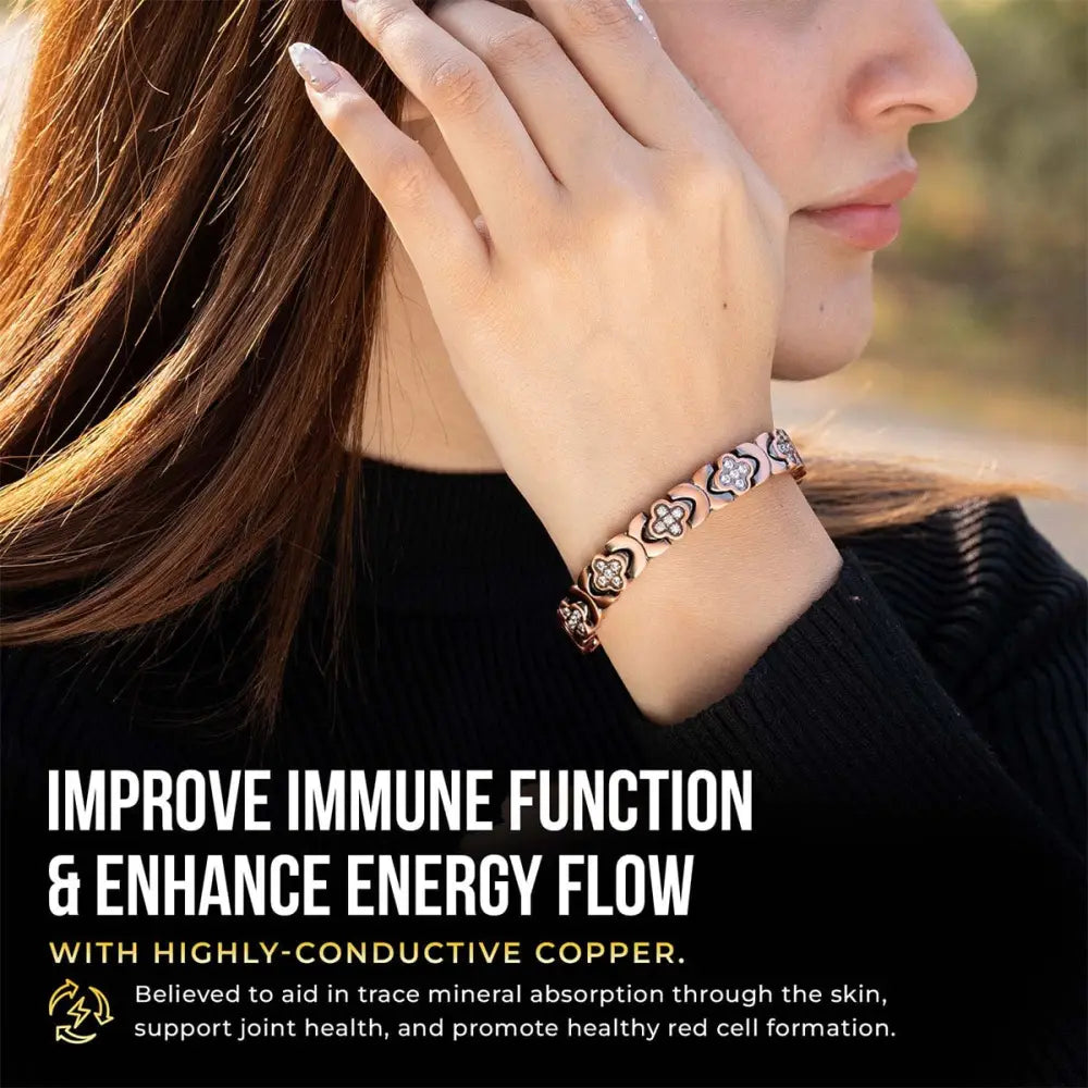 Rose gold copper bracelet with interlocking clover-shaped links and cz crystals embedded for magnetic therapy