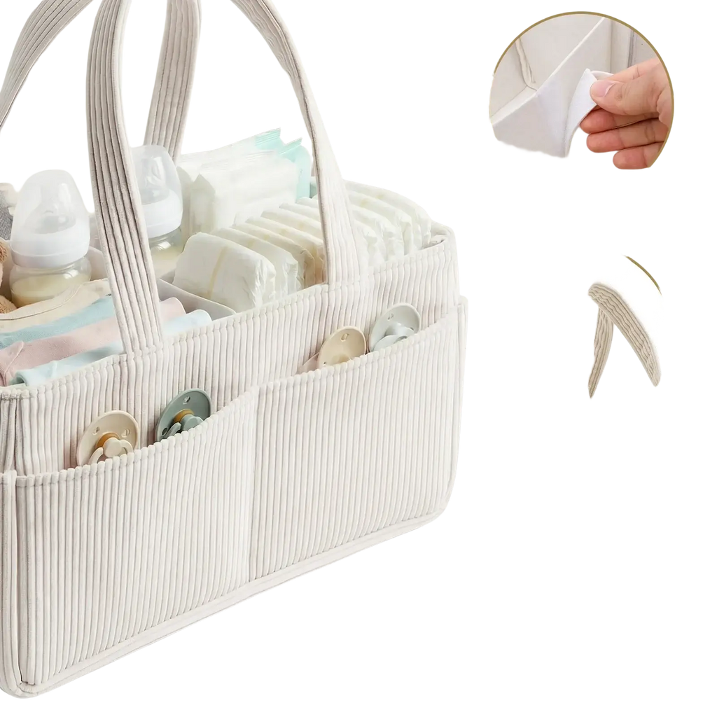 Cream-colored corduroy and felt baby diaper caddy organizer with ribbed texture and multiple compartments for essentials