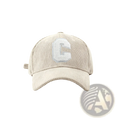 Beige corduroy baseball cap with a white textured embroidered letter c on the front for casual wear