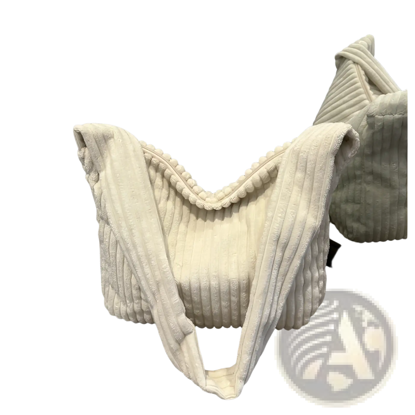 Cream-colored corduroy shoulder tote bag with ribbed texture and pom-pom trim for minimalist streetwear use