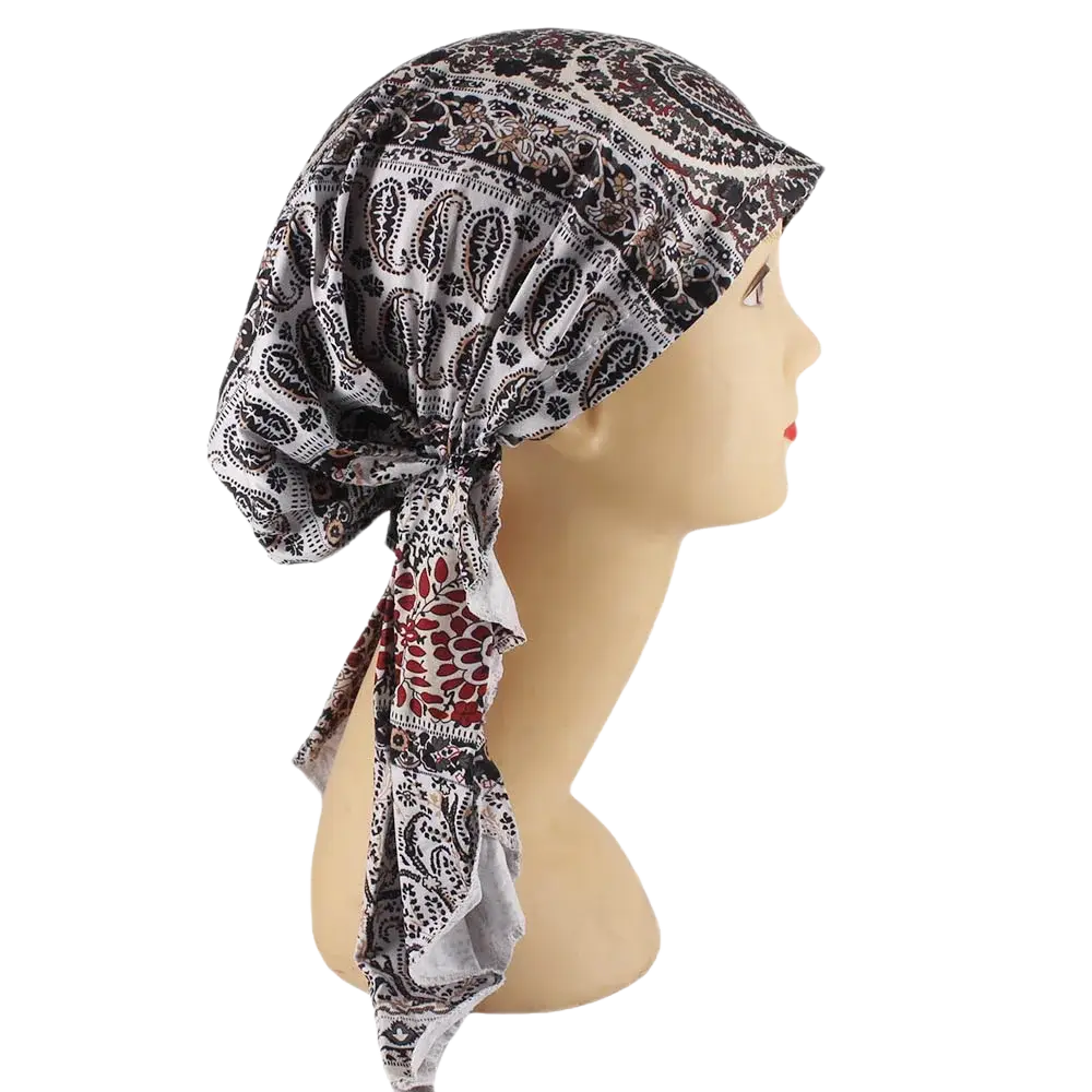 Corduroy turban hijab hat for women in black white and maroon paisley pattern shown from the back with tied knot