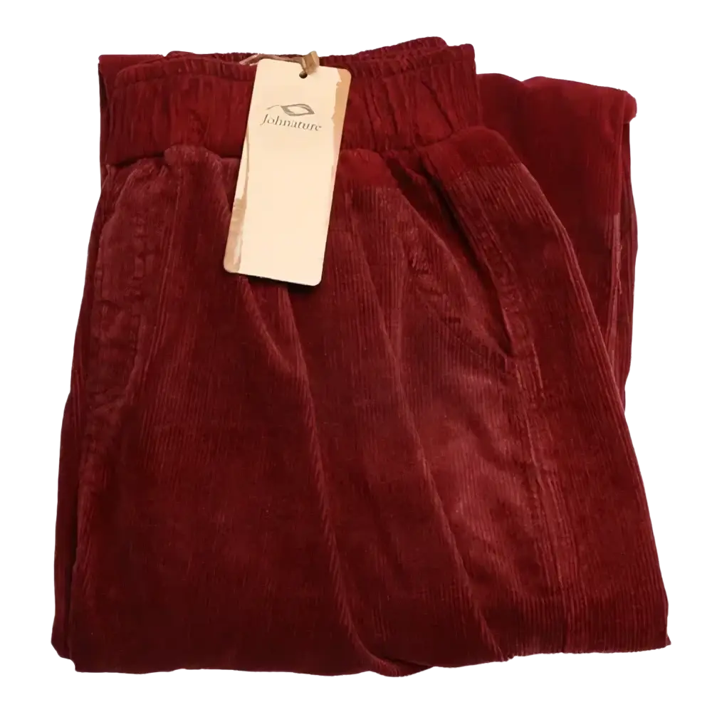 A pair of burgundy corduroy wide leg pants with elastic waist, soft textured fabric, and neatly folded hems