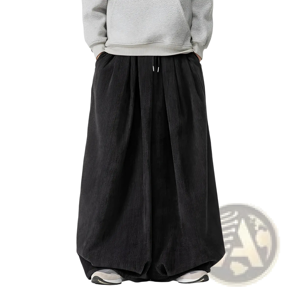 Black corduroy wide leg pants for men with a relaxed silhouette and drawstring waist