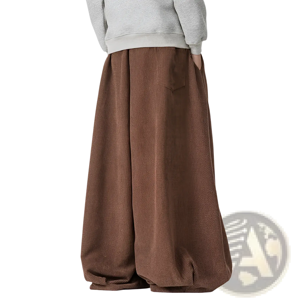 Brown corduroy wide leg pants for men with a relaxed flowing silhouette and a comfortable fit