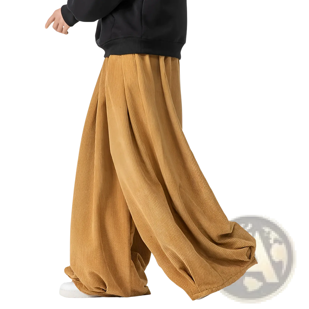 Tan corduroy wide leg pants for men featuring a relaxed flowing silhouette and soft textured fabric