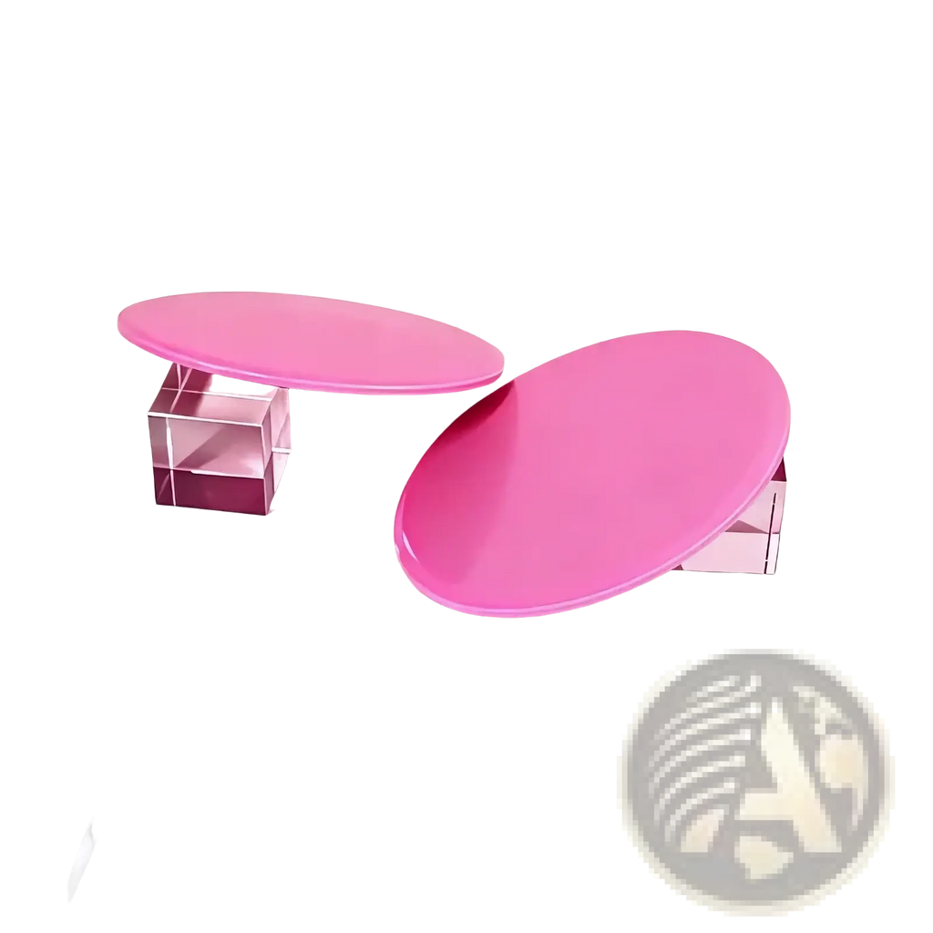 Two glossy pink oval Core Sliders exercise gliding discs resting on transparent crystal cubes for fitness use
