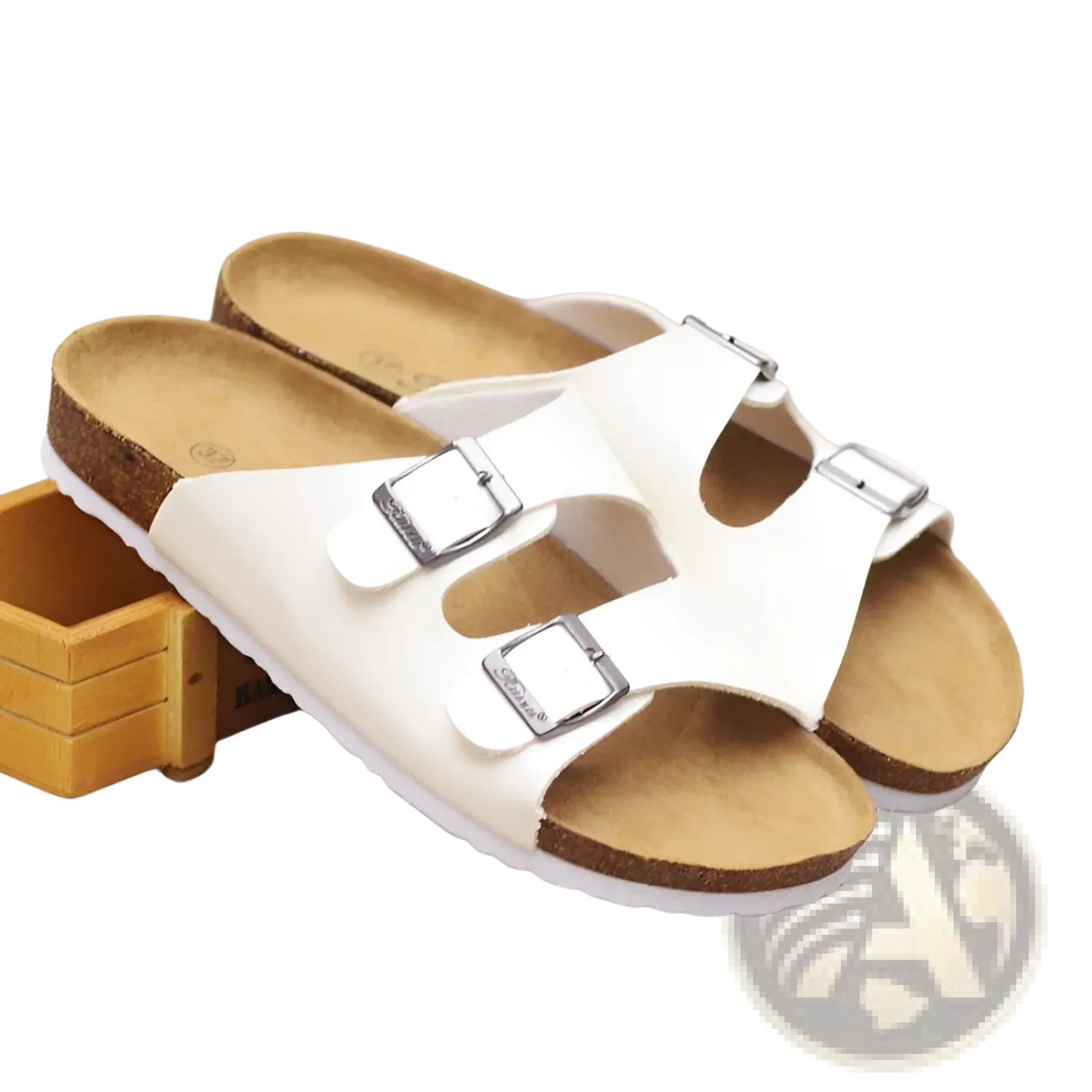 White birkenstock cork footbed leather two strap sandals with silver buckle straps and cork footbed visible from front