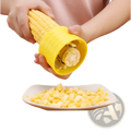Yellow plastic corn grinder thresher manual with stainless steel peeler and textured grip metal cutting mechanism