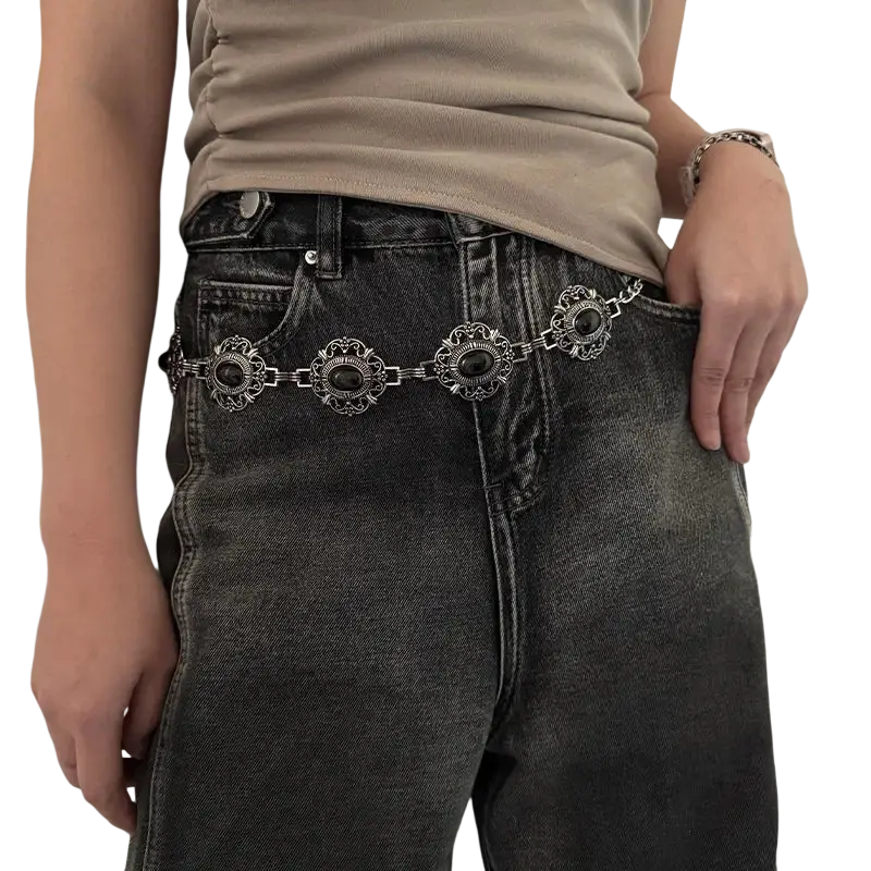 Silver ornate cosplay waist chain belt with intricate floral designs and black oval gem accents for female punk style