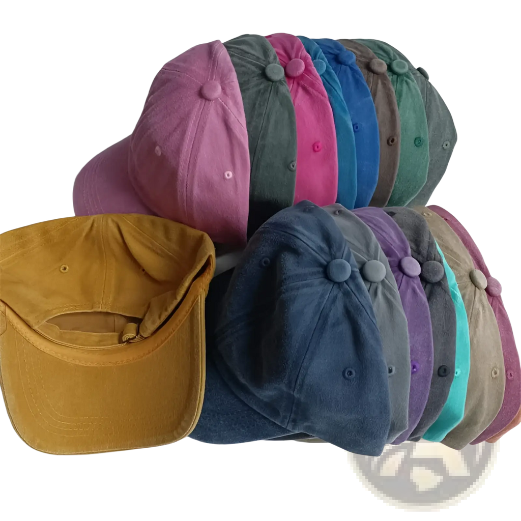 A collection of colorful vintage washed cotton corduroy baseball caps in pink green blue and mustard yellow