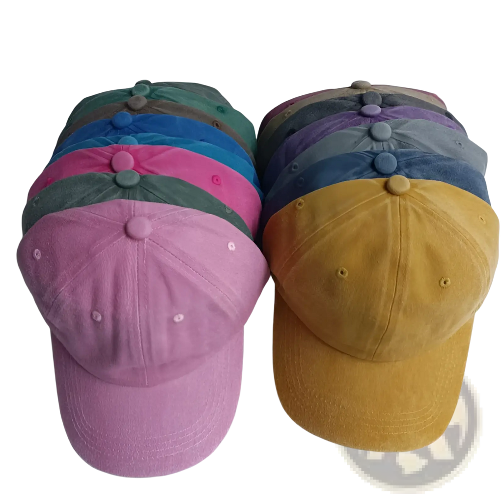 A collection of colorful corduroy cotton baseball caps in pink blue green and mustard yellow vintage washed sun hats