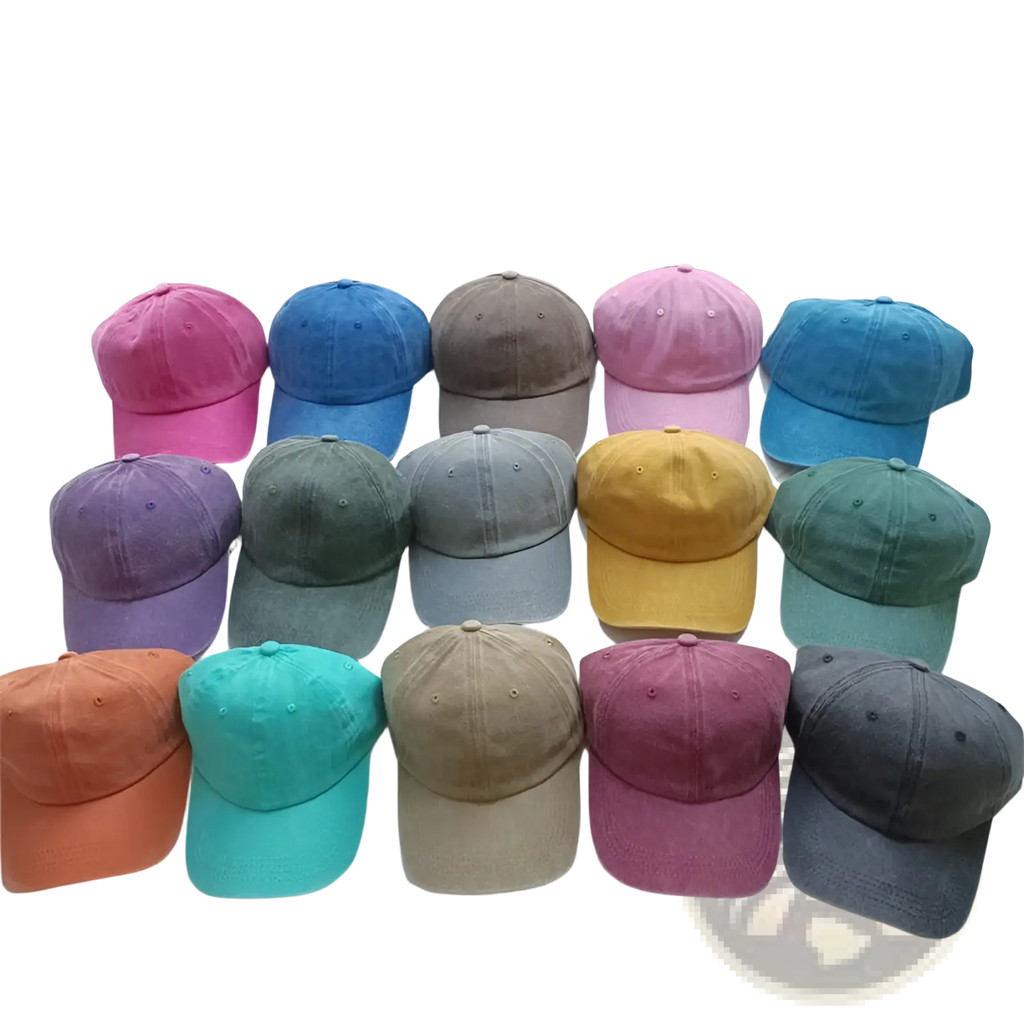 A collection of colorful cotton baseball caps with vintage washed soft texture arranged on a white surface