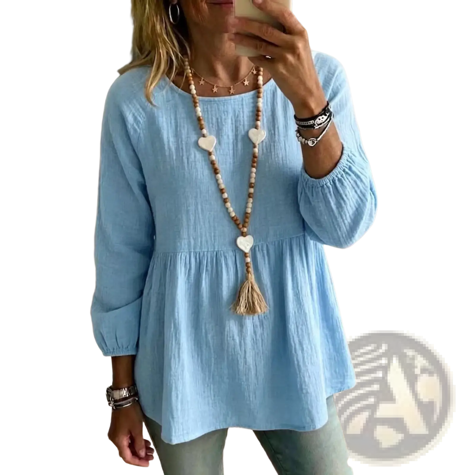 Light blue cotton doll shirt with long sleeves, loose fit, gathered waist, and elastic cuffs for casual wear