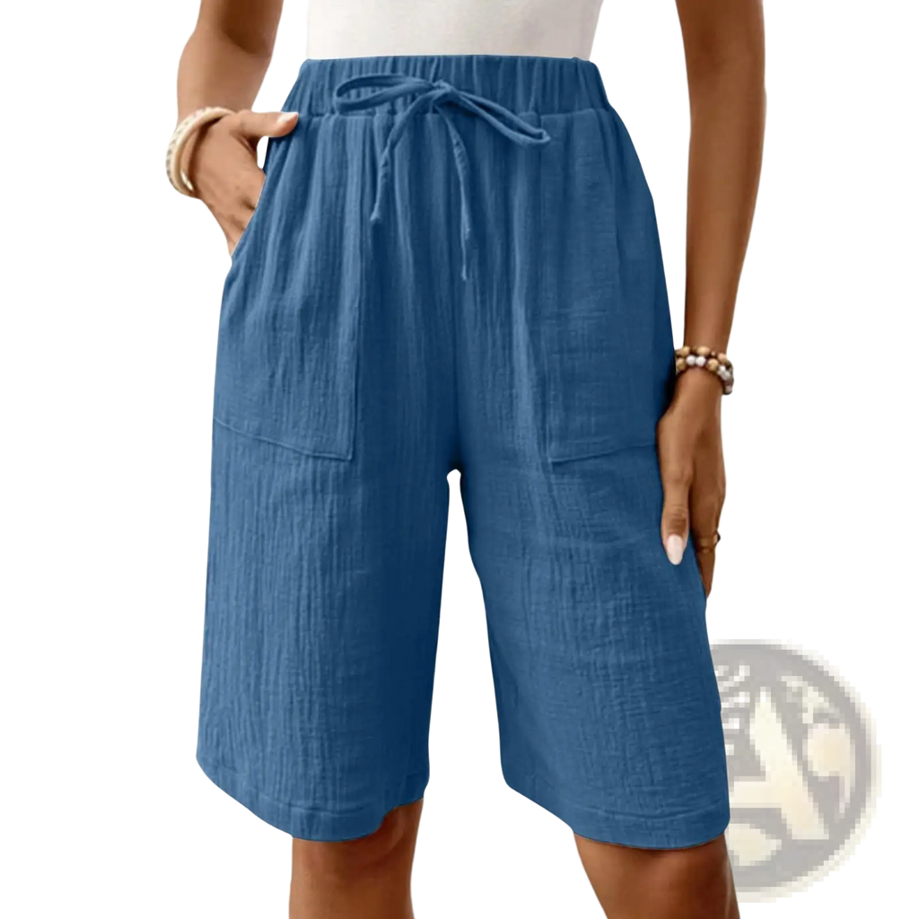 Blue linen cotton drawstring casual capri shorts featuring a waist tie and two front pockets for comfort