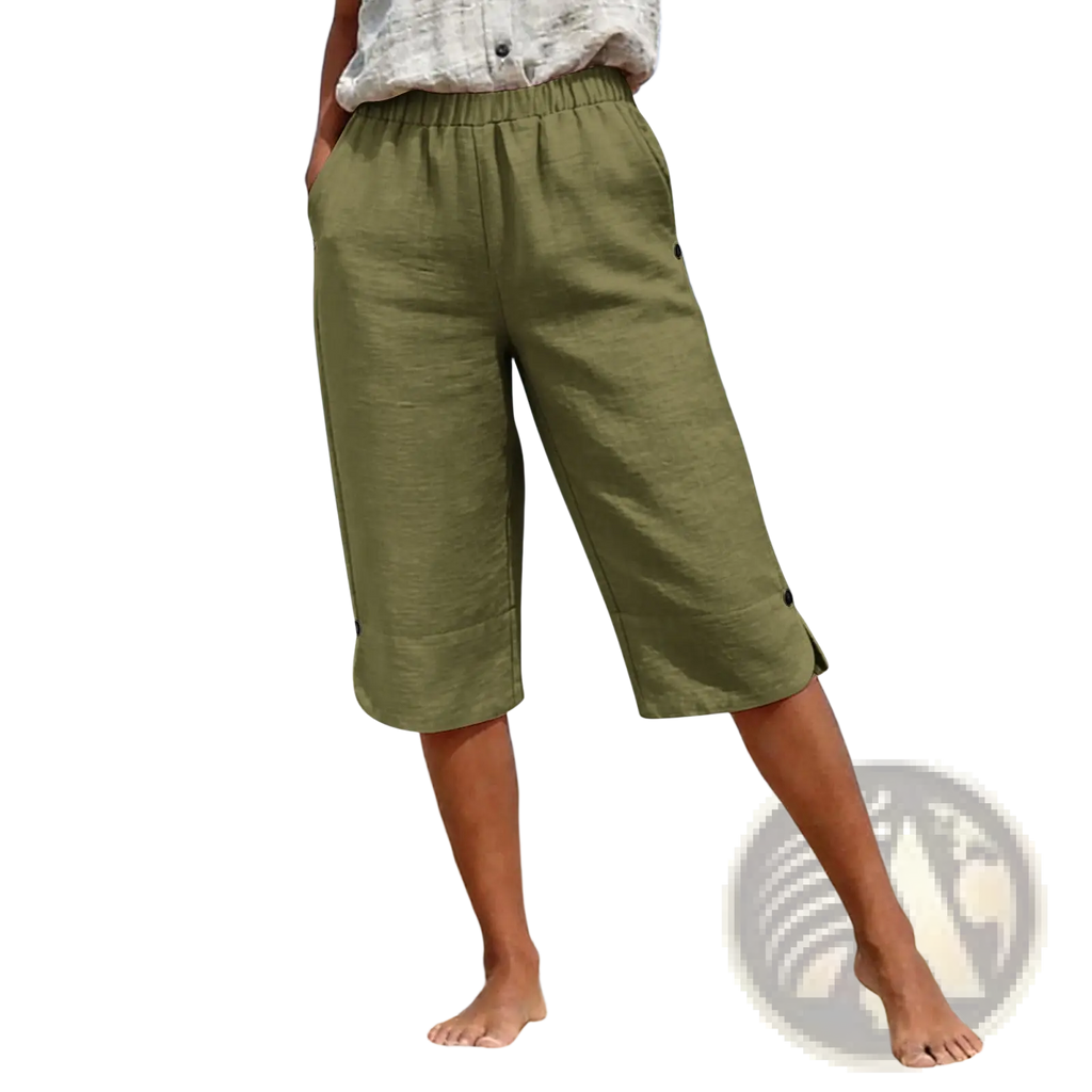 Olive green cotton linen capri pants with high waist elastic waistband and button details on the cuffs