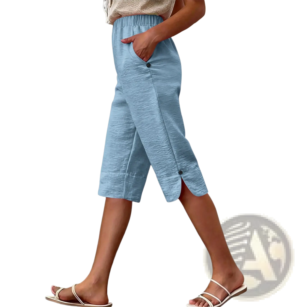 Light blue cotton linen high waist capri pants with textured fabric button details and side slit