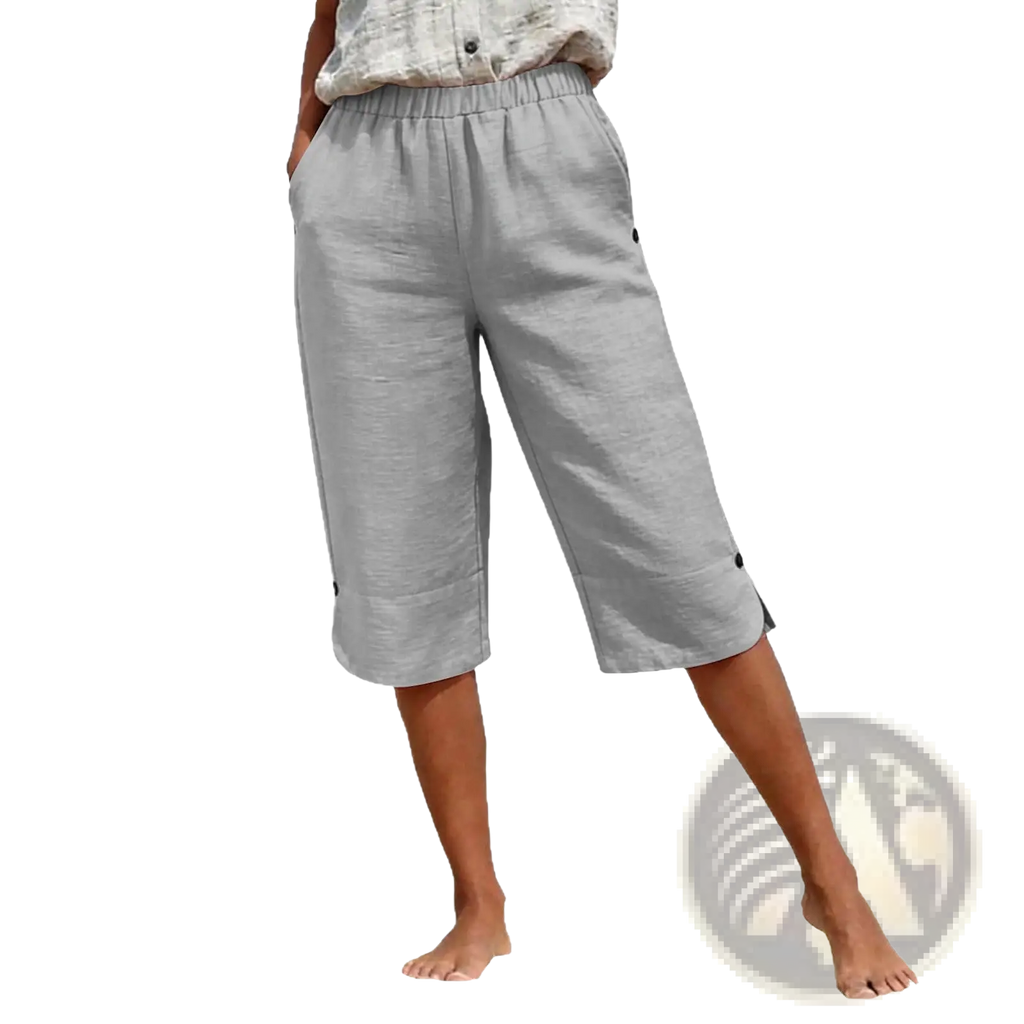 Light gray cotton linen capri pants with high waist elastic waistband and black button accents