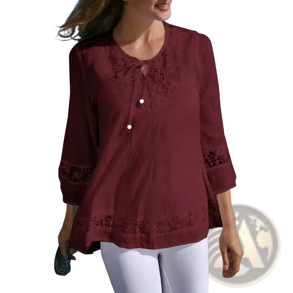 A maroon cotton linen blouse with delicate lace detailing on neckline cuffs and hem for women’s spring wear
