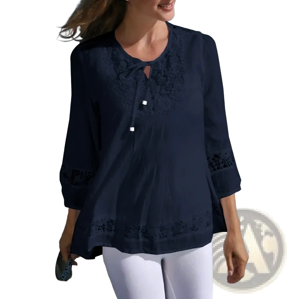 Navy blue cotton linen blouse with embroidered lace detailing at neckline sleeves and hem for spring wear