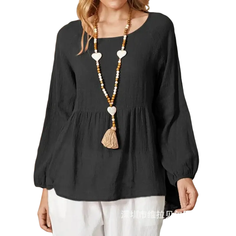 Black cotton linen long sleeve loose blouse with peplum waist and gathered cuffs in a formal style