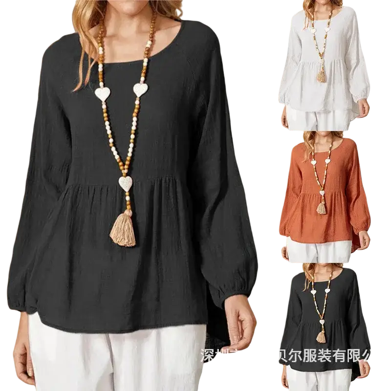 Long-sleeved black peplum top with relaxed fit and soft flowing fabric made of cotton linen for comfortable wear